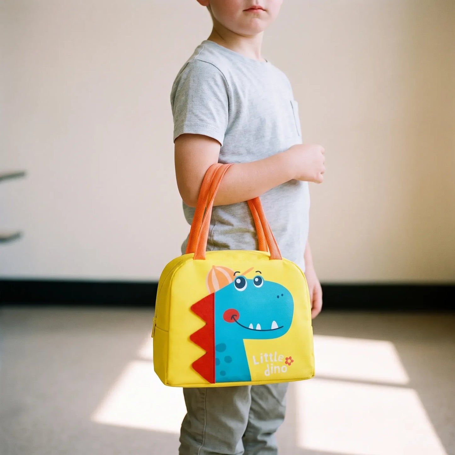 Coco | Bolsa térmica infantil con dinosaurio y asas superiores