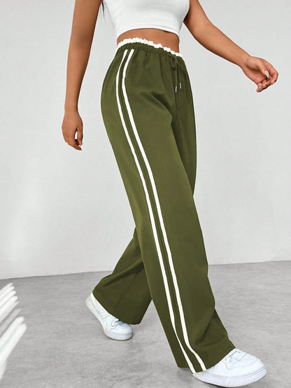 Katia | Pantalón deportivo con cintura alta y rayas laterales corte suelto